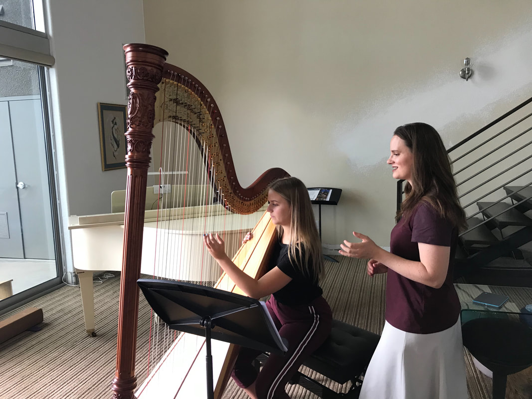 Kristie teaching a harp lesson at her studio in the Summerlin neighborhood of Las Vegas.